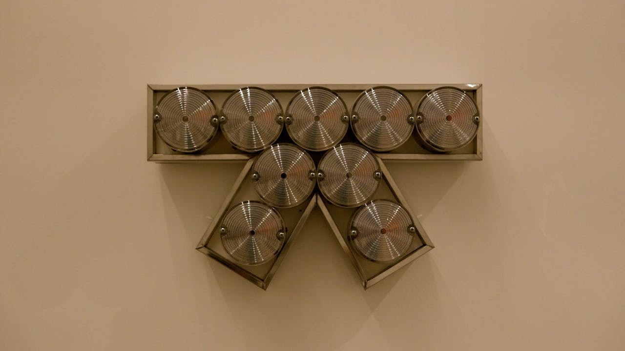 An electronically powered light sculpture with different color lightbulbs lighting up in different sequences.